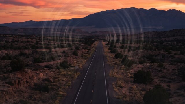 Acoustic ripple distortions over the lone highway desert horizon of Taos at sunset